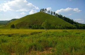 big green hill on a summer day