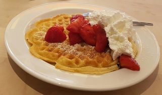 airy waffles with strawberries and cream