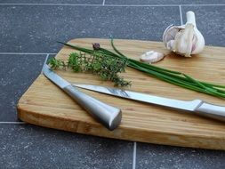 herbs and garlic on the cutting board