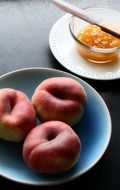 Peaches on blue plate