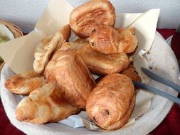 little buns on a napkin on a plate