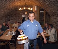 waiter with beer in hand