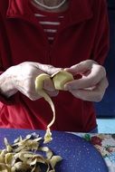 woman peeling Potato