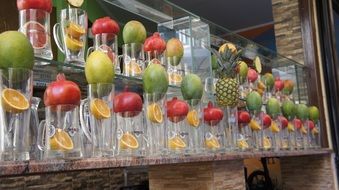 Fruits in empty glasses