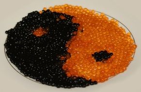 Red and black delicious Caviar yīn yáng closeup