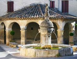 Beautiful Sculpture of stone fountain near the arches