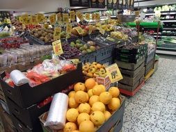 fruits and vegetables with yellow price tags in a super market