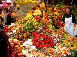 Lots of fruits and vegetables in a market