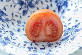 Half of mini tomato in the bowl