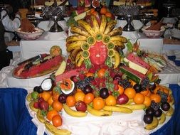 Different colorful fruits and berries in the buffet