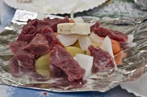 meat,onions and carrots cut for dinner