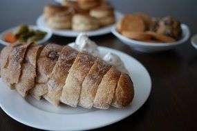 fresh sliced wheat bread on the plates for breakfast