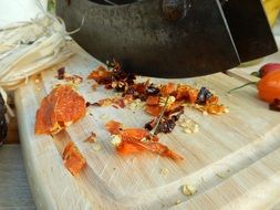 Dried Cut Chili on wood closeup