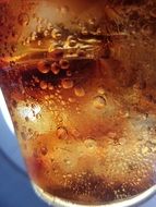 cold cola in a transparent glass