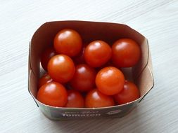 cherry tomatoes in a small container