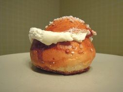 Shrove bun on the plate