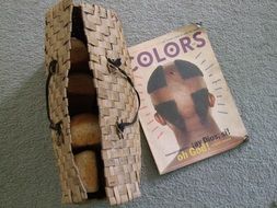 bread in a wicker basket and a fashion magazine