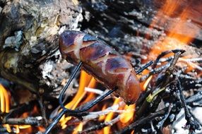 fried sausage on the fire