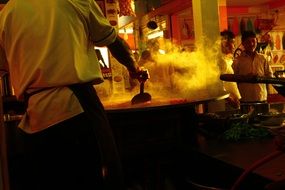 cooking dosas outdoors