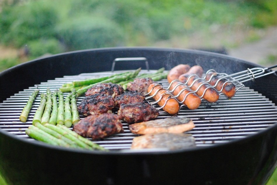 appetizing Grilling Hotdogs with vegetables on the grill