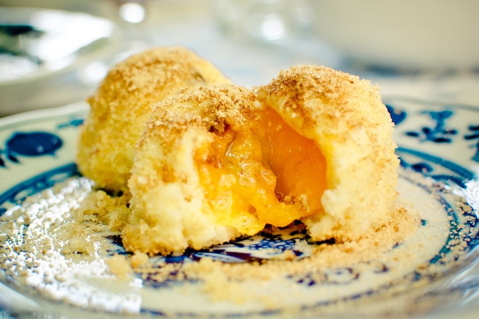 Apricot Dumplings on a painted plate close-up