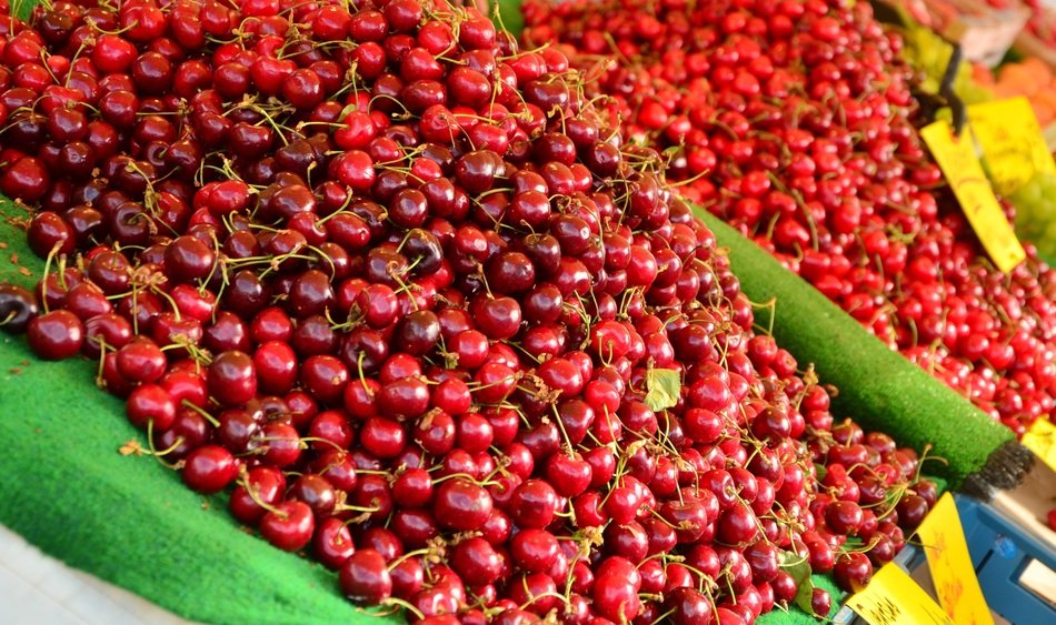 lot of cherries on the market close-up