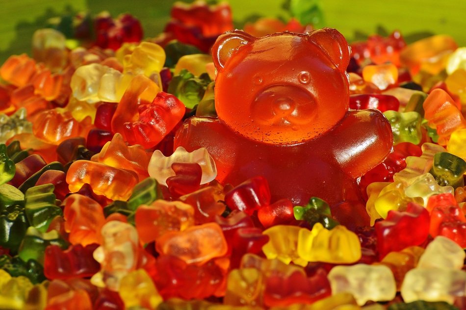 big gummy bear among candies