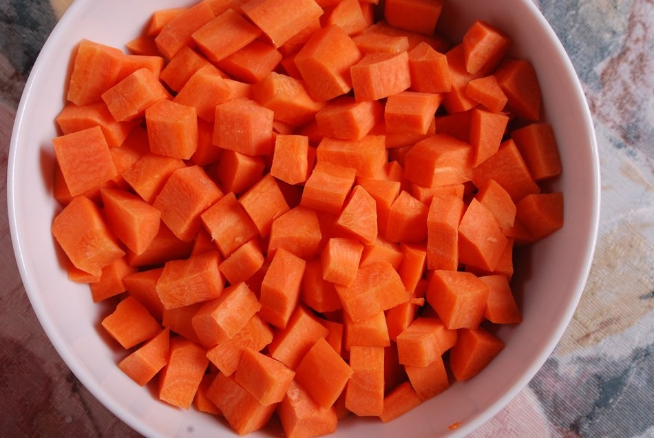 fresh Carrots Diced in white bowl