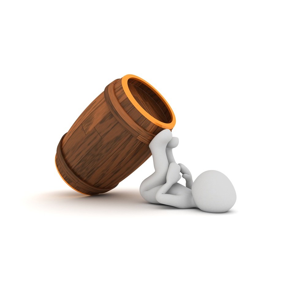 wooden barrel and human figurine