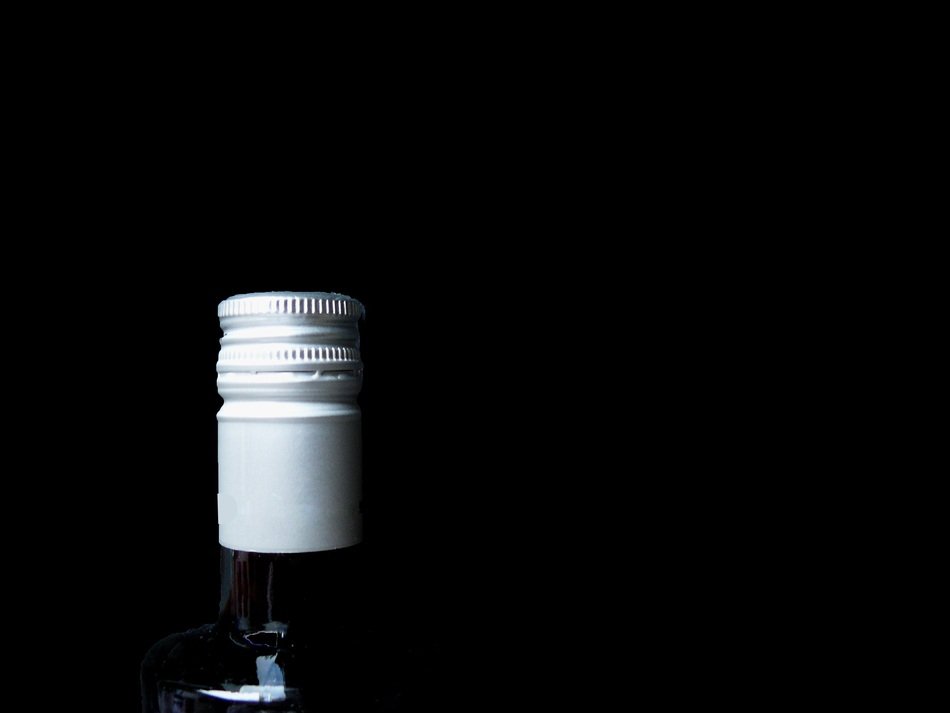 corked neck of Wine Bottle at dark background