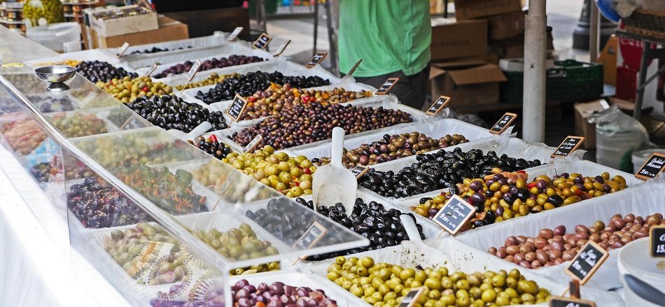 olives of different varieties on the counter