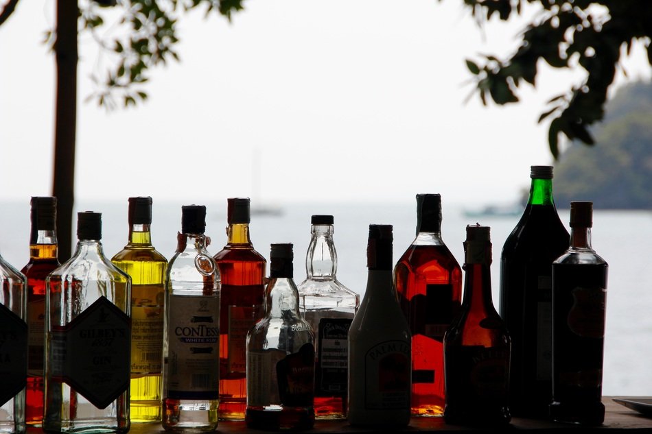 many bottles of alcohol on the beach