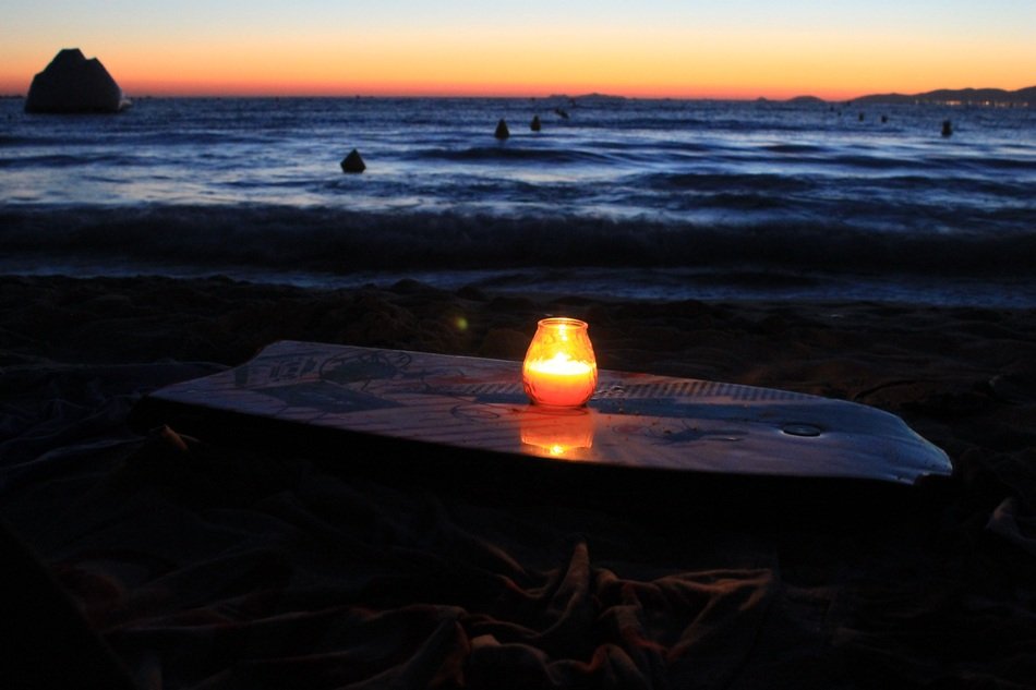 outdoor candle at sunset on the beach