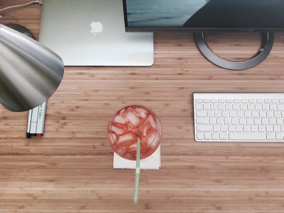 drink with ice on a computer table