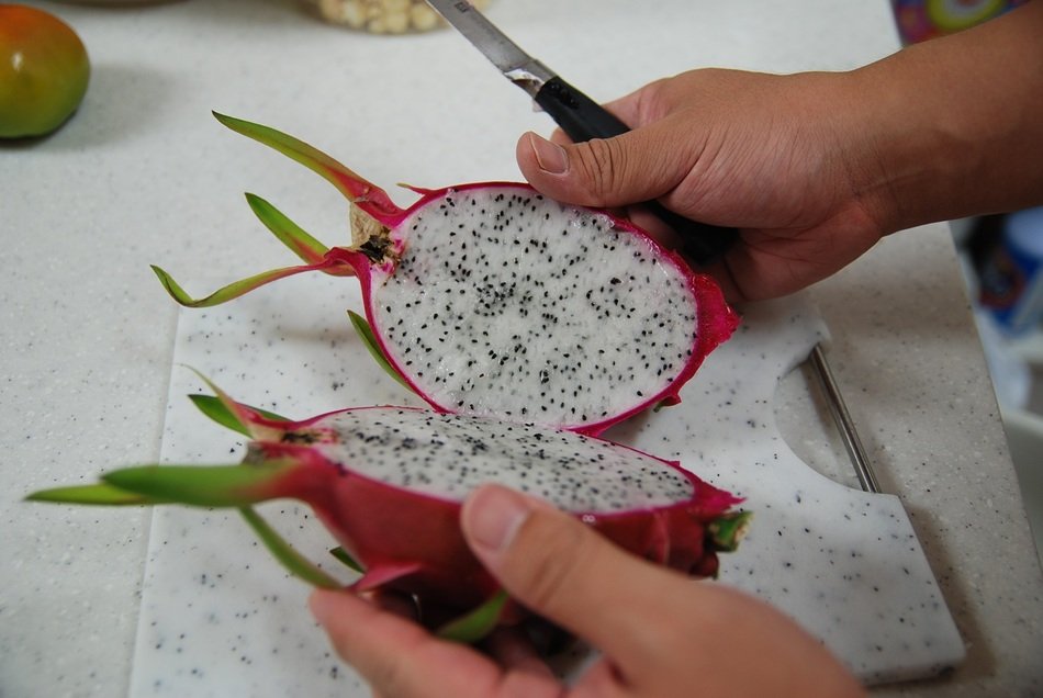 cut pitaya, Dragon fruit in hands