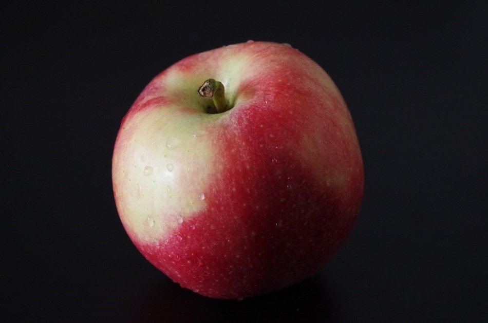 juicy apple on the black background
