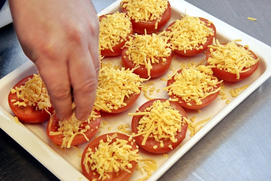 Tomatoes with cheese ready for oven