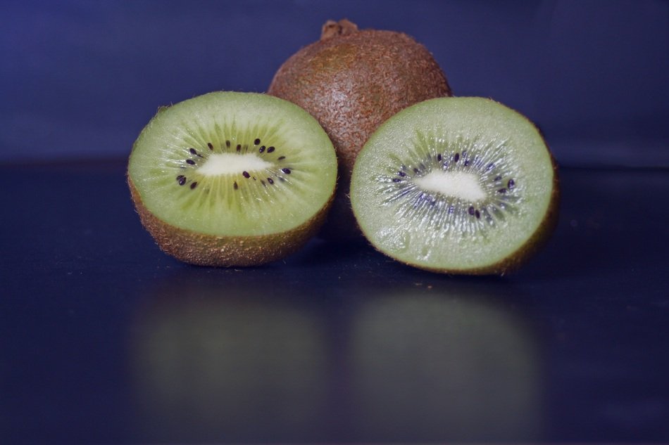 tasty healthy Kiwi with reflection on the surface