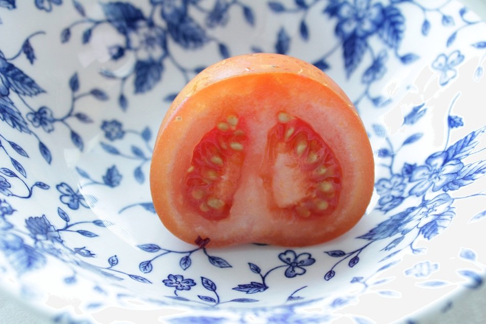 Half of mini tomato in the bowl