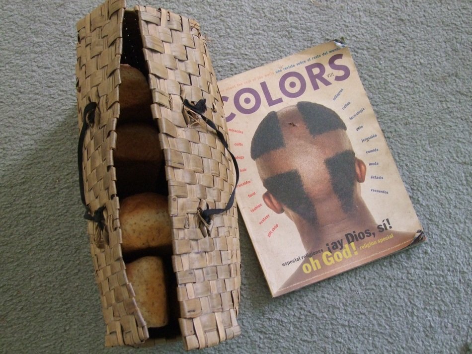 bread in a wicker basket and a fashion magazine