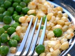 green peas and corn on a plate