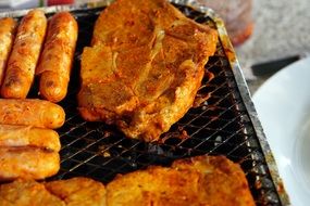 barbecue with meat and sausages