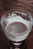 frothy beer in a glass