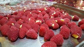 raspberries on a metal tray