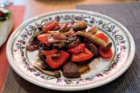 beef meat with vegetables on a beautiful plate