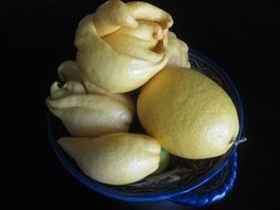 lemons and citrus fruits in a plate