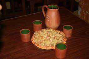 pizza on the table with drinks