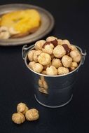 peeled hazelnuts in Bucket