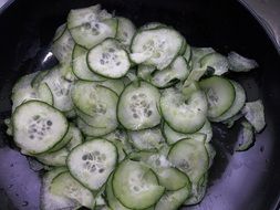 cucumber salad in a purple bowl