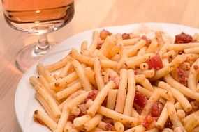 pasta with tomatoes on a white plate